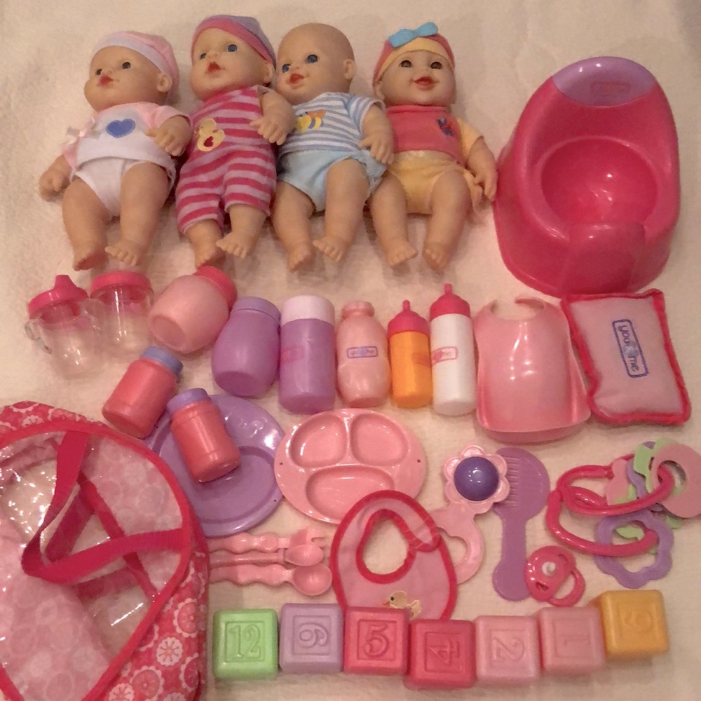 4 Baby Dolls with Care Accessories